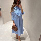 Vestido em popelina com riscas e laço à frente