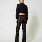 Conjunto Twinset de cardigan e calça em croché preto