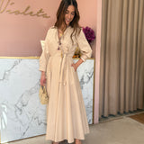 Vestido midi em bege com laço a trespasse