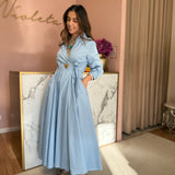 Vestido midi em azul céu com laço a trespasse no