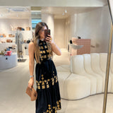 Vestido camiserio midi preto com bordados dourados
