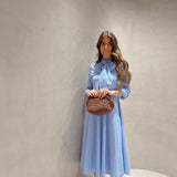 Vestido em popelina com riscas e laço à frente