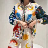 Conjunto de camisa e calça com estampado multicolor
