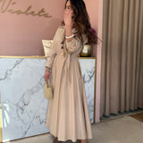 Vestido midi em bege com laço a trespasse