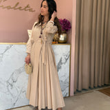 Vestido midi em bege com laço a trespasse