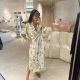 Vestido comprido com bolsos